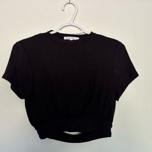 The brand is Antistar, size L, black, ribbed material, cutout in back